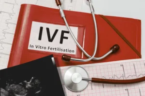 Stethoscope resting on a red folder labeled IVF outlining how long does ivf take in singapore.